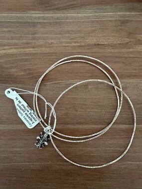 Silver-tone Triple Bangle Bracelet with Fleur-de-lis Charm